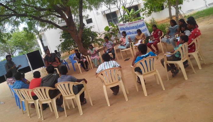 Group meeting held outdoors in the village