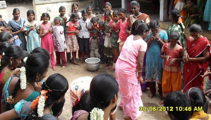 Children and women at a community celebration