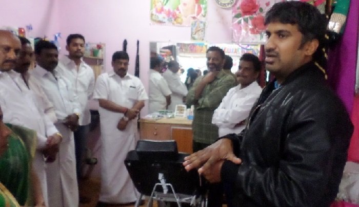 Speaker addressing community members at a programme