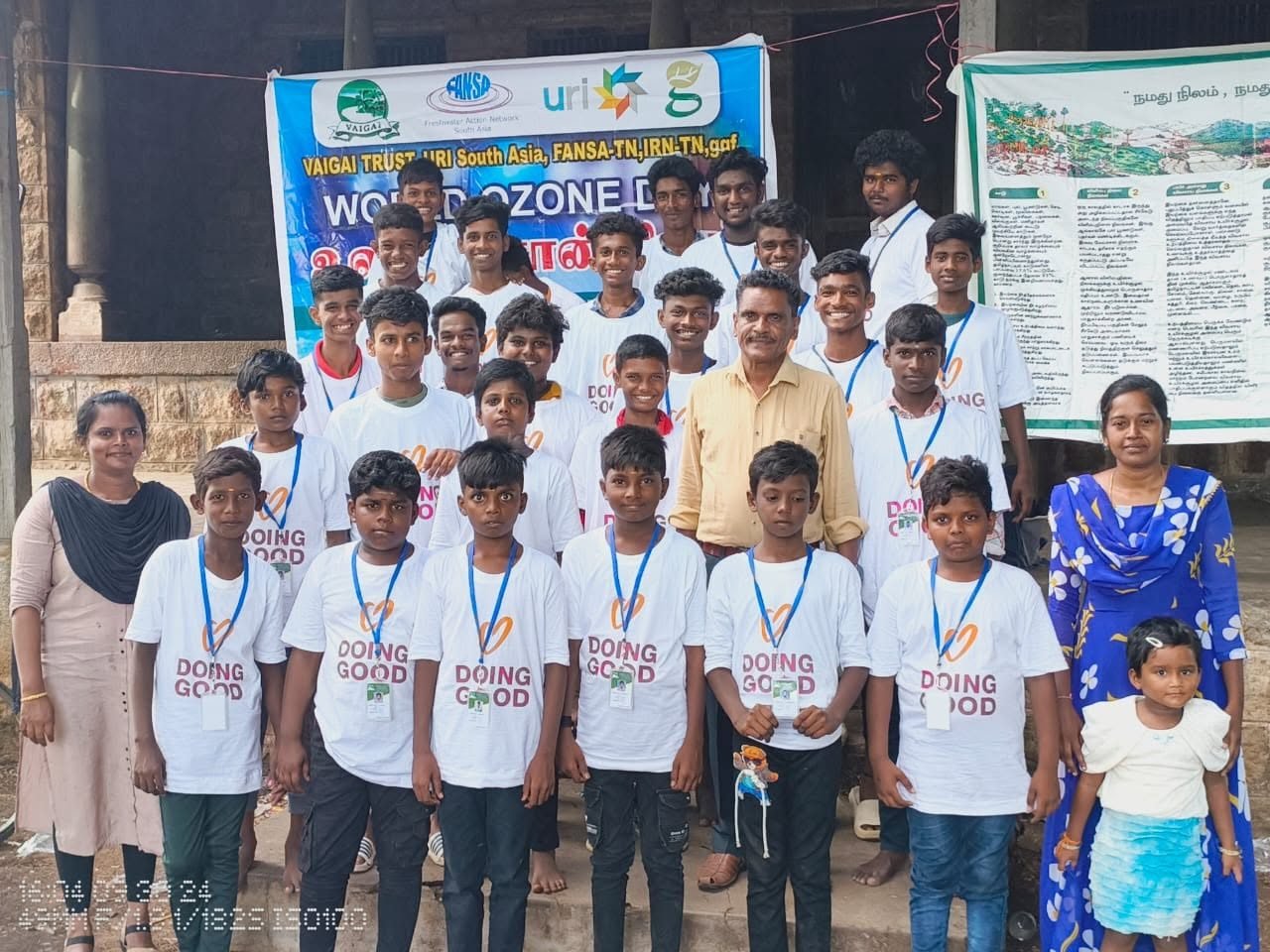 Group of boys with volunteers at a children's programme