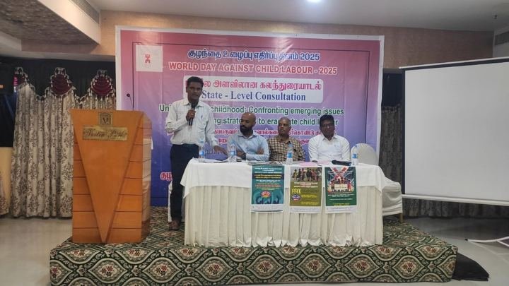 Speakers and participants at a consultation meeting in a hall