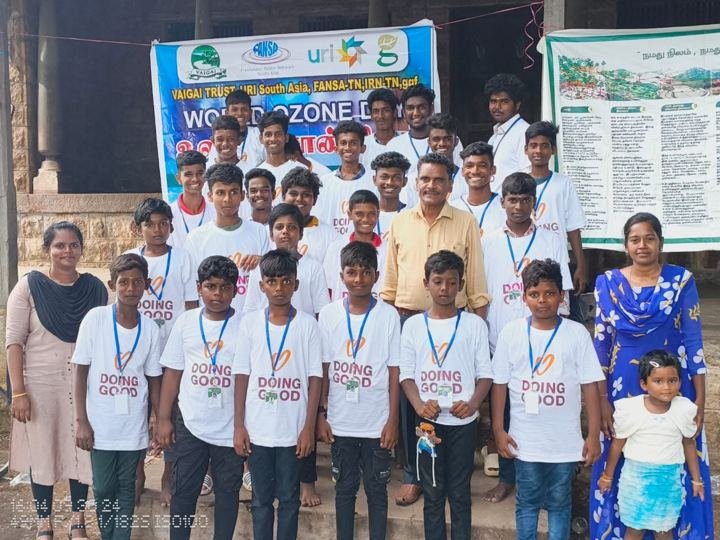 Boys and volunteers at a children's programme