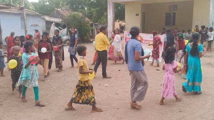 Children playing games outdoors at an awareness activity