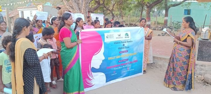 Women with a banner during a street awareness campaign