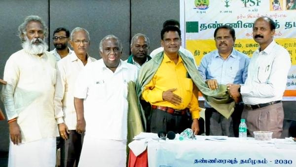 Group photo with shawls at a felicitation event