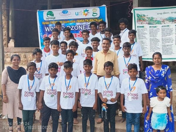 Group of boys with banners at a school or village event